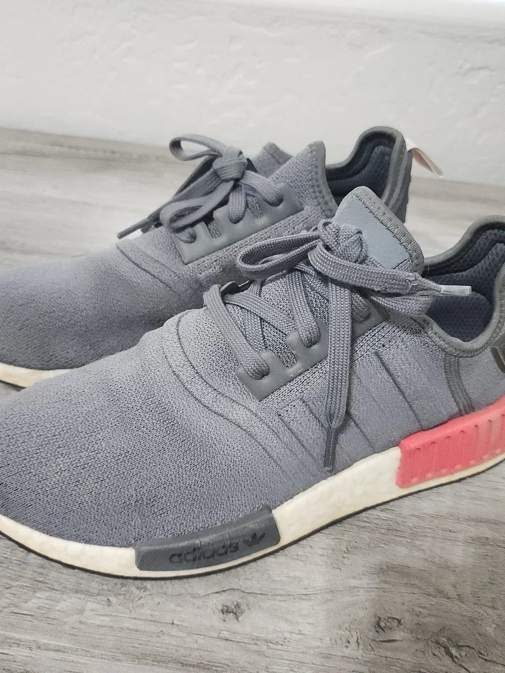 adidas Men’s Gray NMD_R1 Casual Sneaker with Red Accents